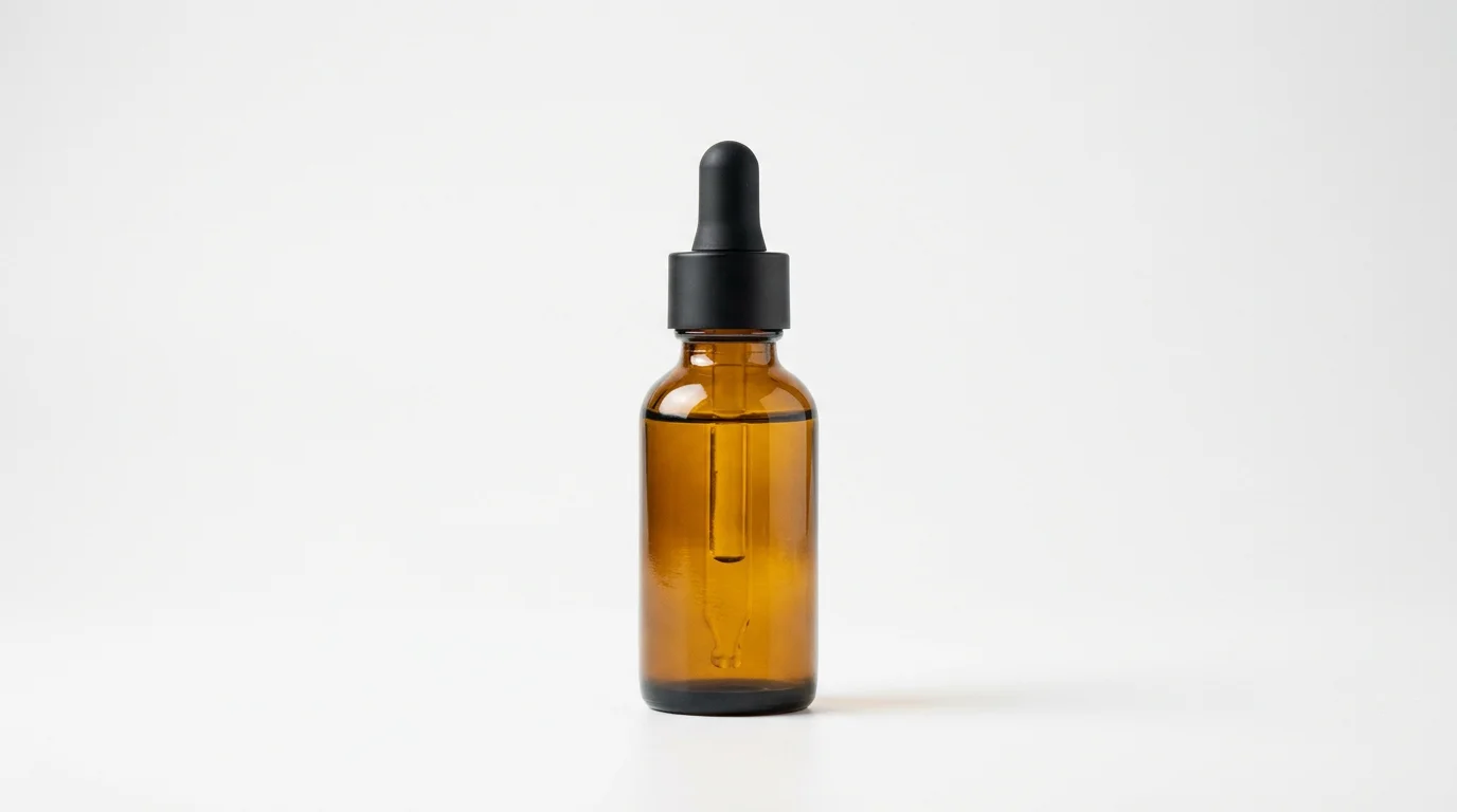 Ecommerce product photography of an original amber serum dropper bottle on a clean white background