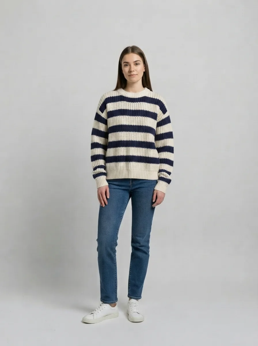 AI virtual try-on result: the striped chunky knit sweater rendered onto a person in a studio photo